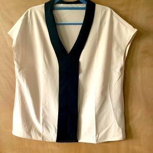 Sleeveless tan and black shirt